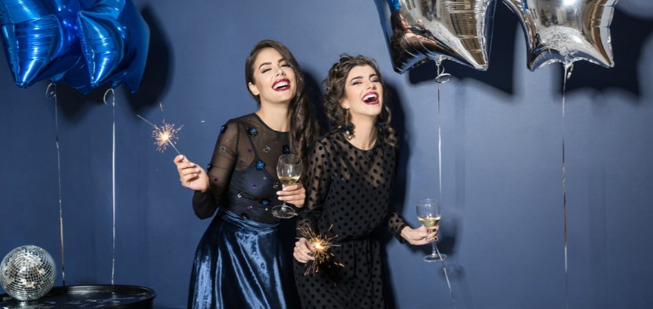 Two young women in party dresses