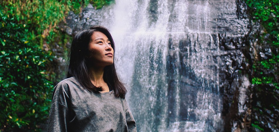 Woman by a water retention fall