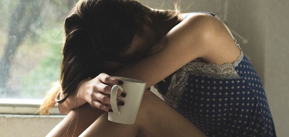 Young woman wanting a hangover cure