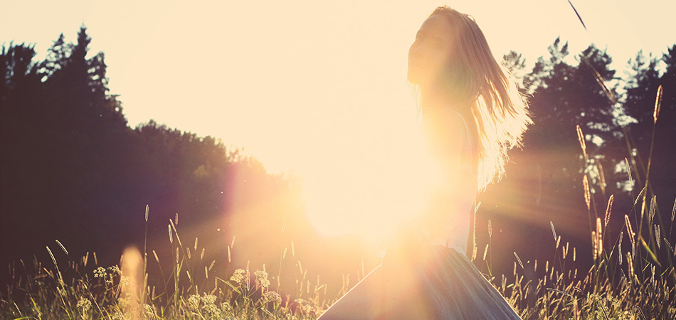 Happy young woman in nature