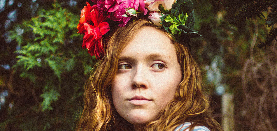 Young woman with flowers | nutrition and teenage acne acne