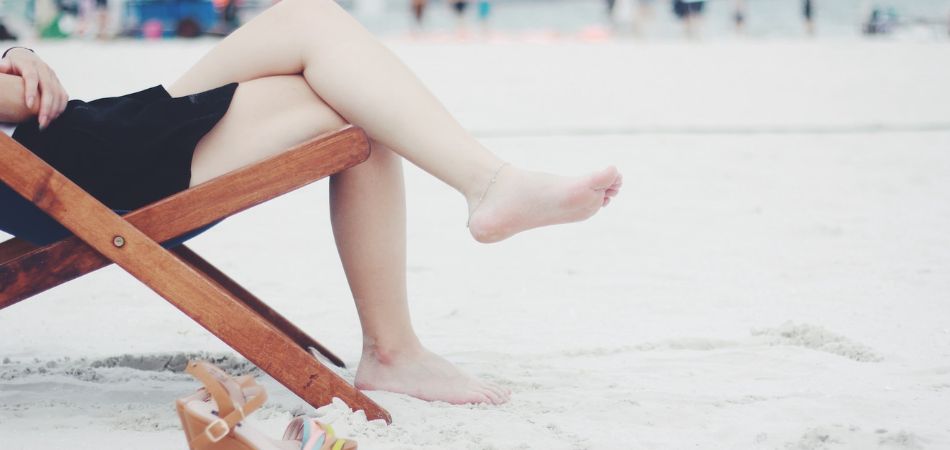 Woman relaxing on a deckchair | water retention remedies