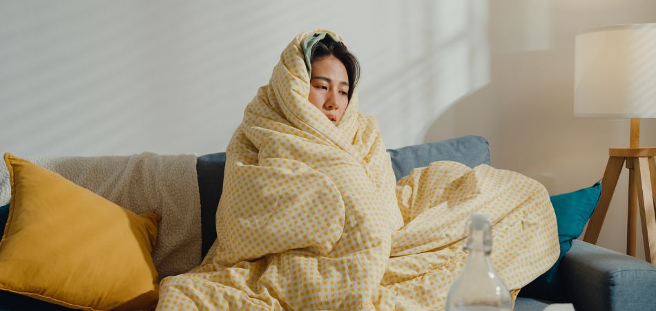 Snuggled woman | How to beat a cold